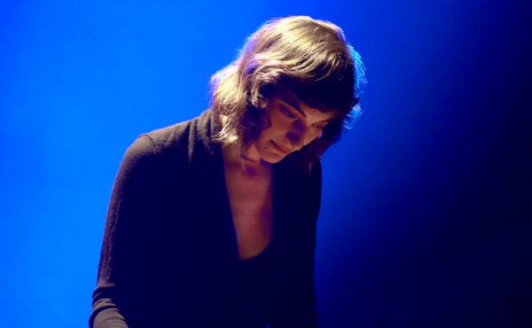 Picture of Lea Bertucci with blue background